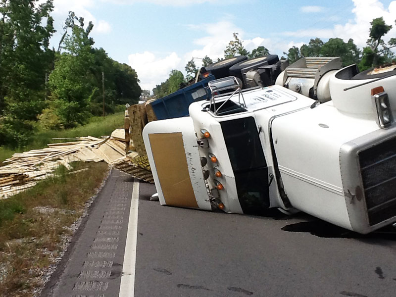 A lumber truck from Fayette tipped after avoiding hitting a car AL13S in Haleyville